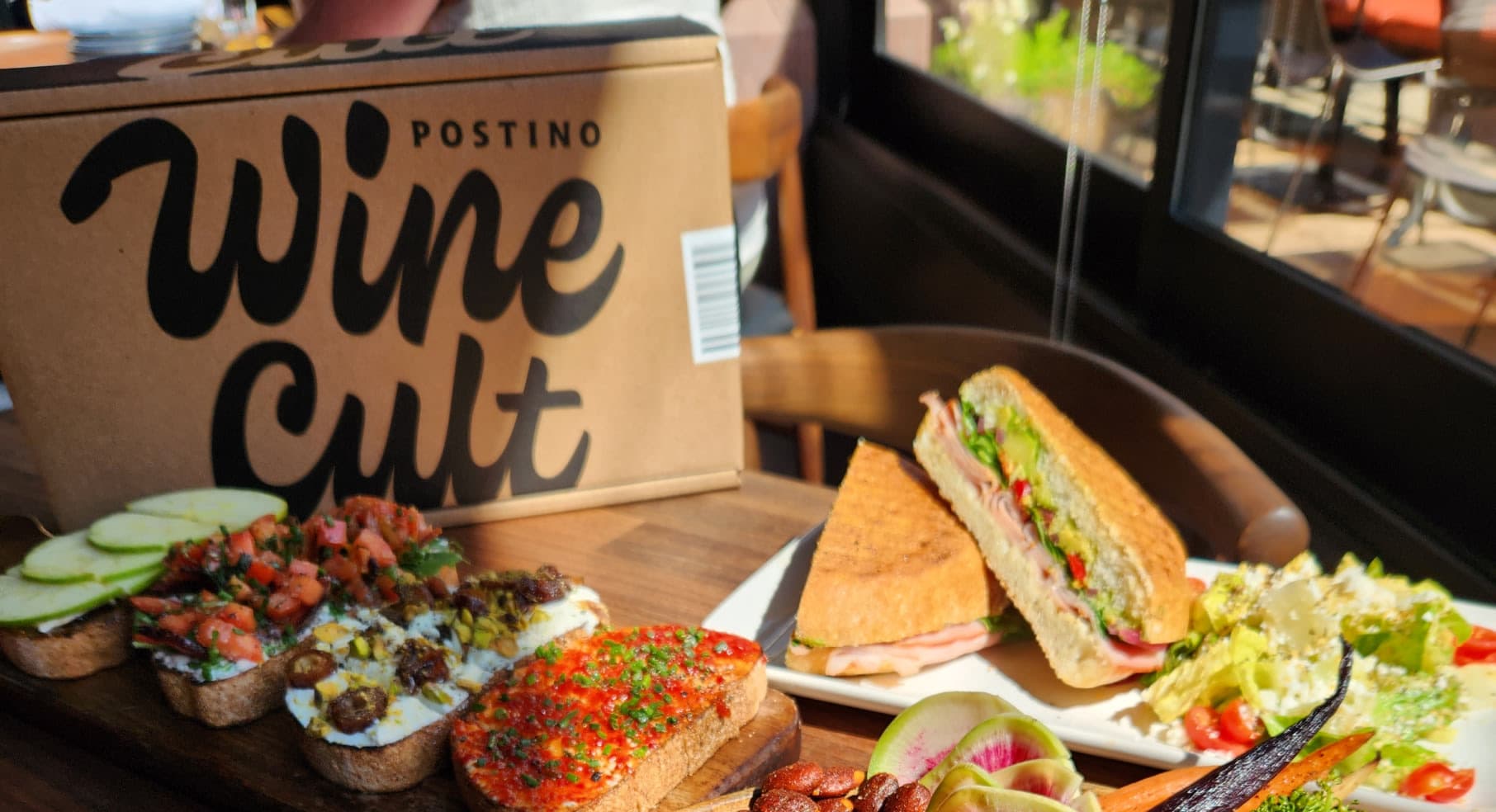 Wine Cult box on a table with Postino bruschetta